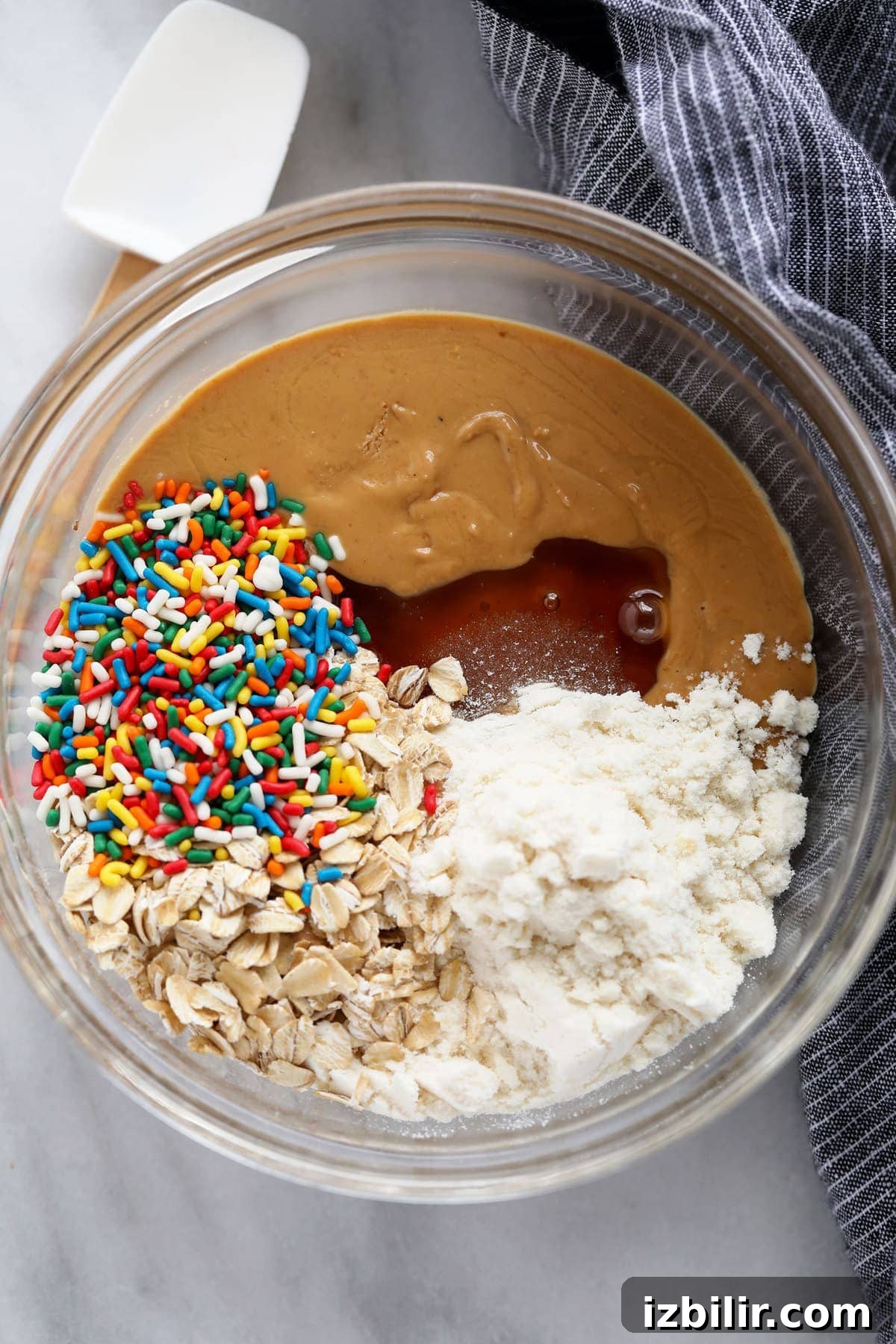 cake batter protein ball ingredients in a bowl ready to be mixed