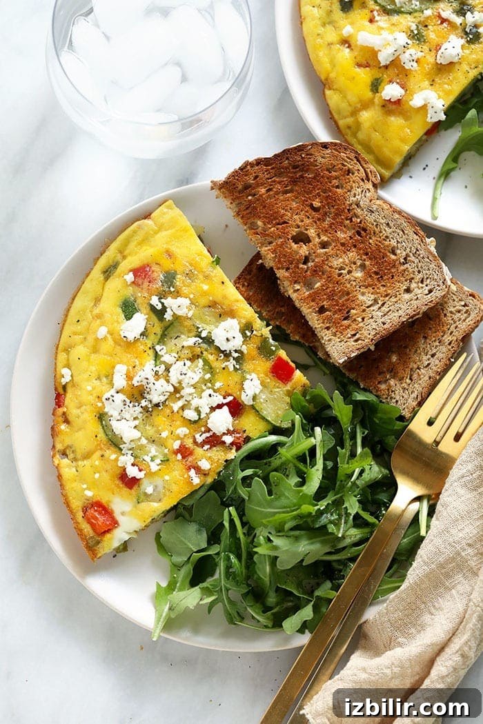 How to Make a Fluffy Frittata 5 Plated frittata, toast, and arugula.