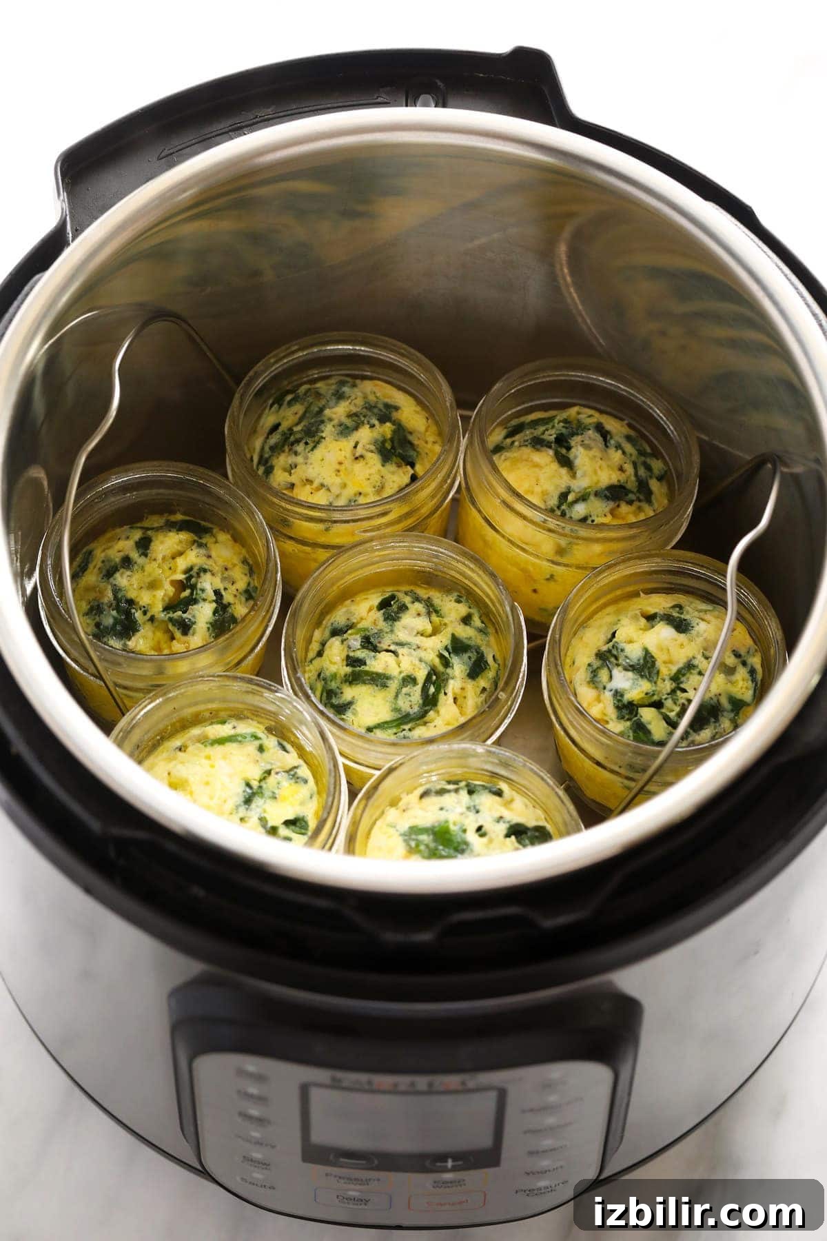 Starbucks-Style Instant Pot Egg Bites Recipe 7 Instant Pot egg bites in glass jars.
