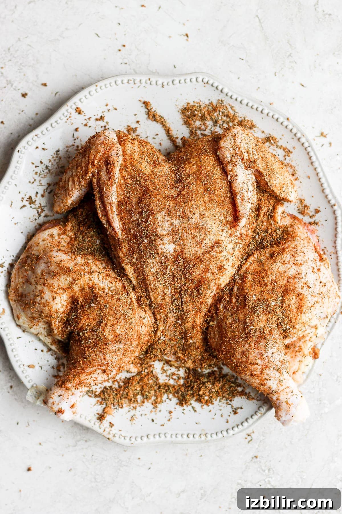 Dry rub on spatchcock chicken.