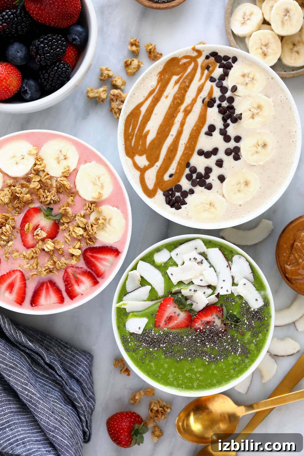 3 smoothie bowls with toppings