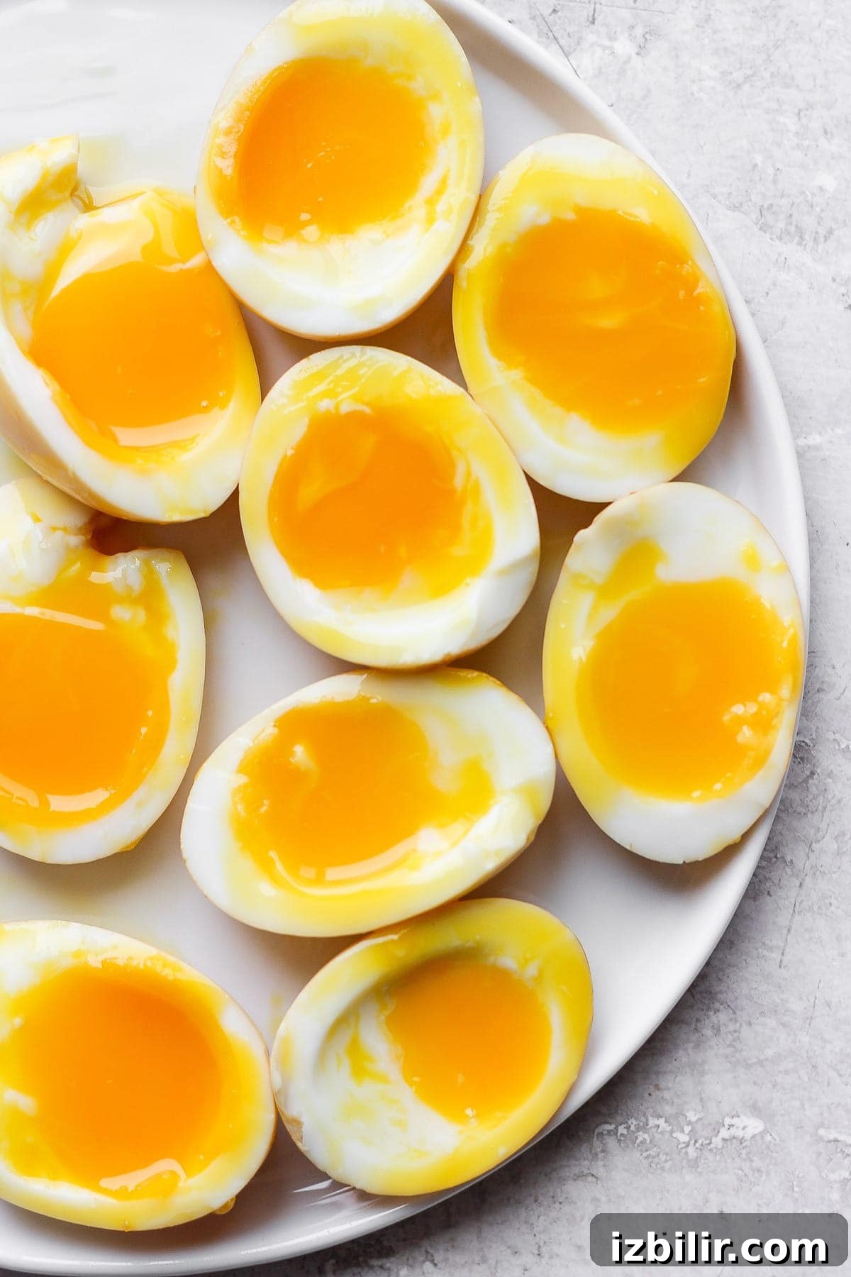 Soft boiled ramen eggs on a plate.