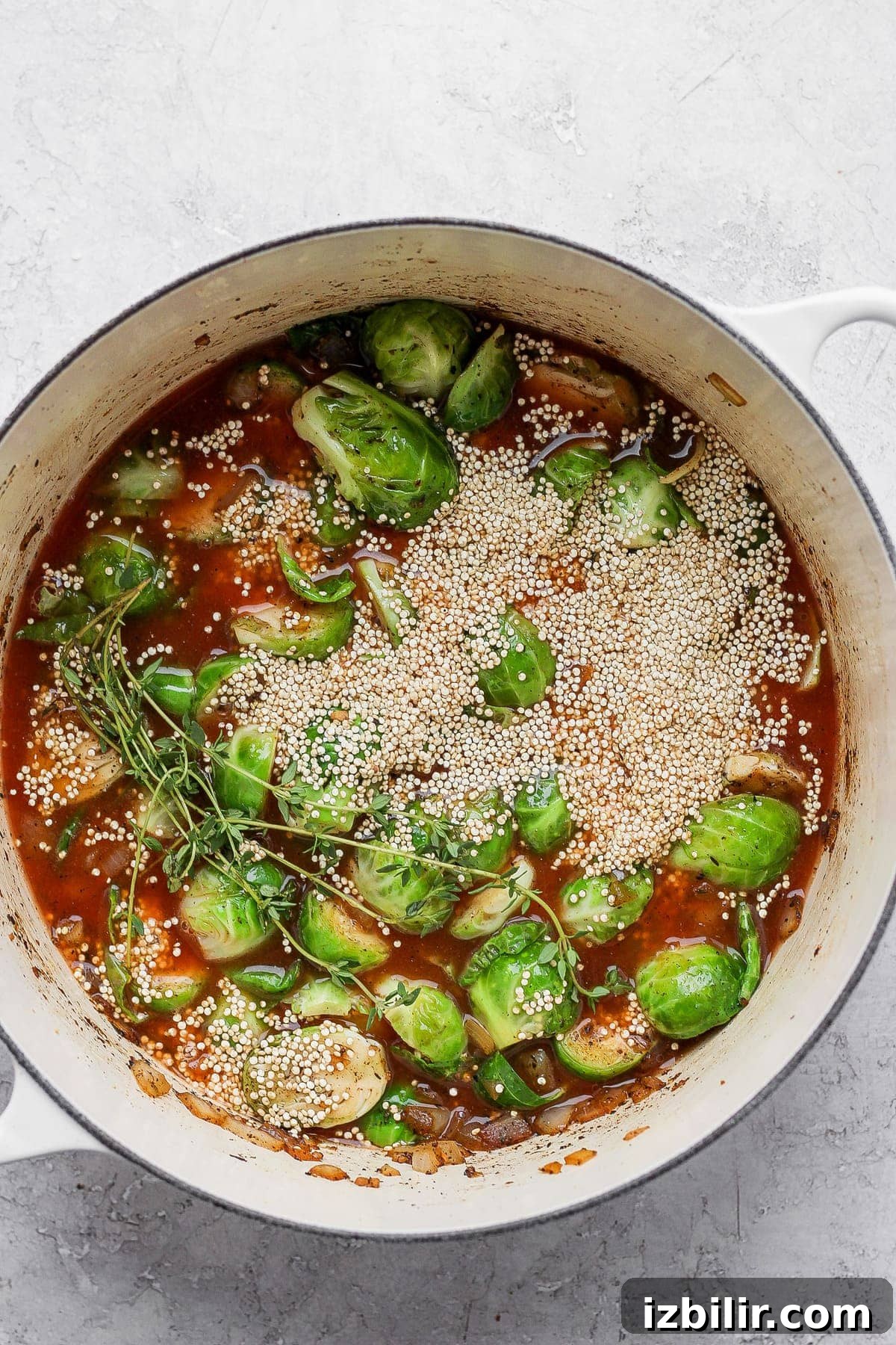 Dutch Oven Chicken Thighs with Crispy Brussels Sprouts 6 Brussels sprouts, uncooked quinoa, and broth in Dutch oven