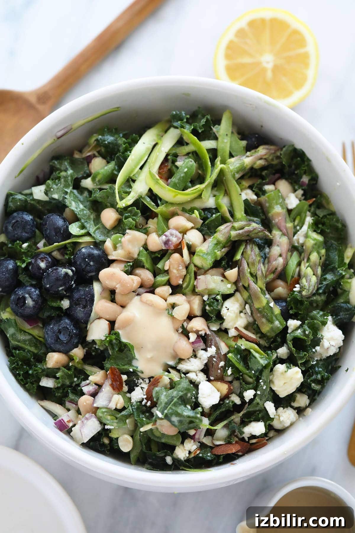 Spring Asparagus Salad with Lemon Vinaigrette 4 Asparagus salad in a mixing bowl.