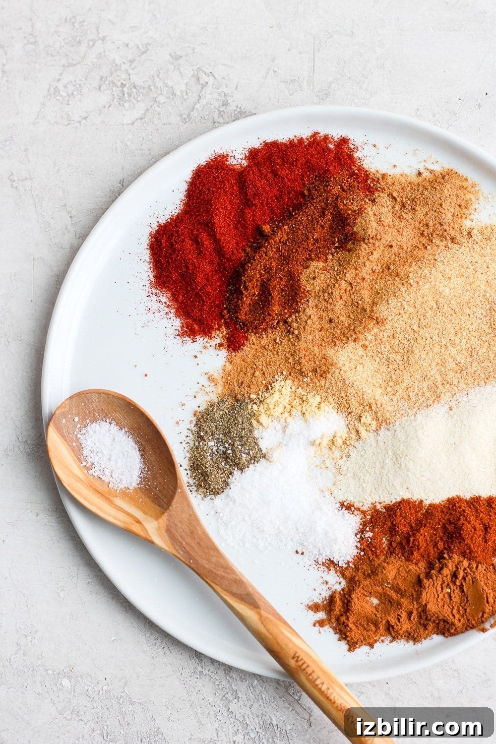 A seriously delicious dry rub for chicken that is slightly sweet and smoky at the same time! dry rub ingredients on a plate