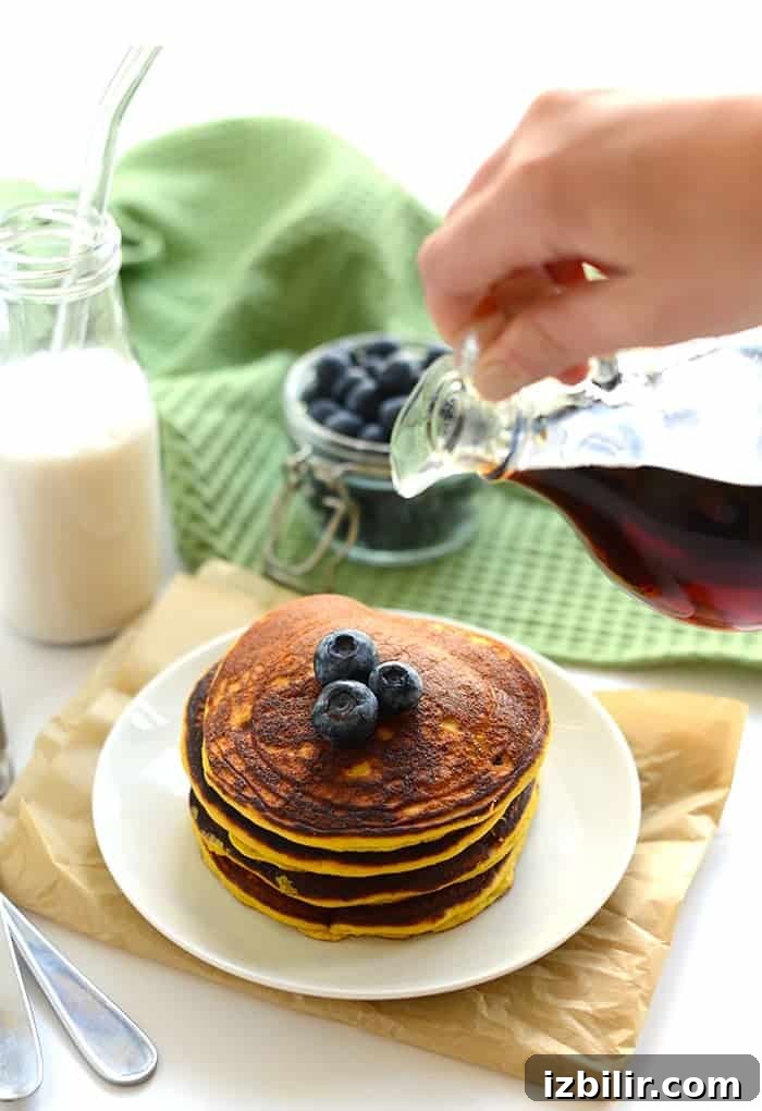 These are the best Paleo Coconut Flour Pancakes you'll ever make! They're made with just 4 main ingredients and a little coconut oil making them grain-free, dairy-free, and refined sugar free!