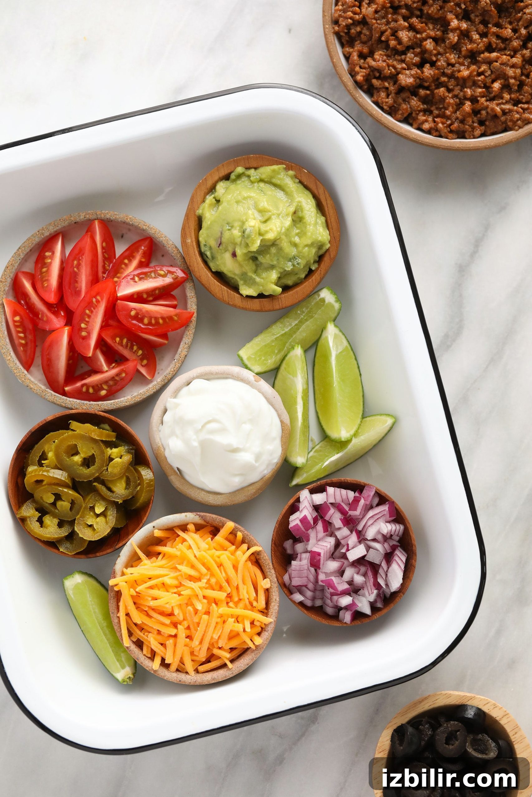 beef nachos toppings in container