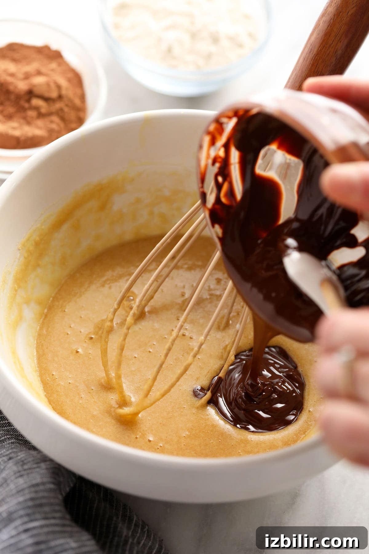 Classic Fudgy Chocolate Brownies Recipe 5 pouring chocolate into batter