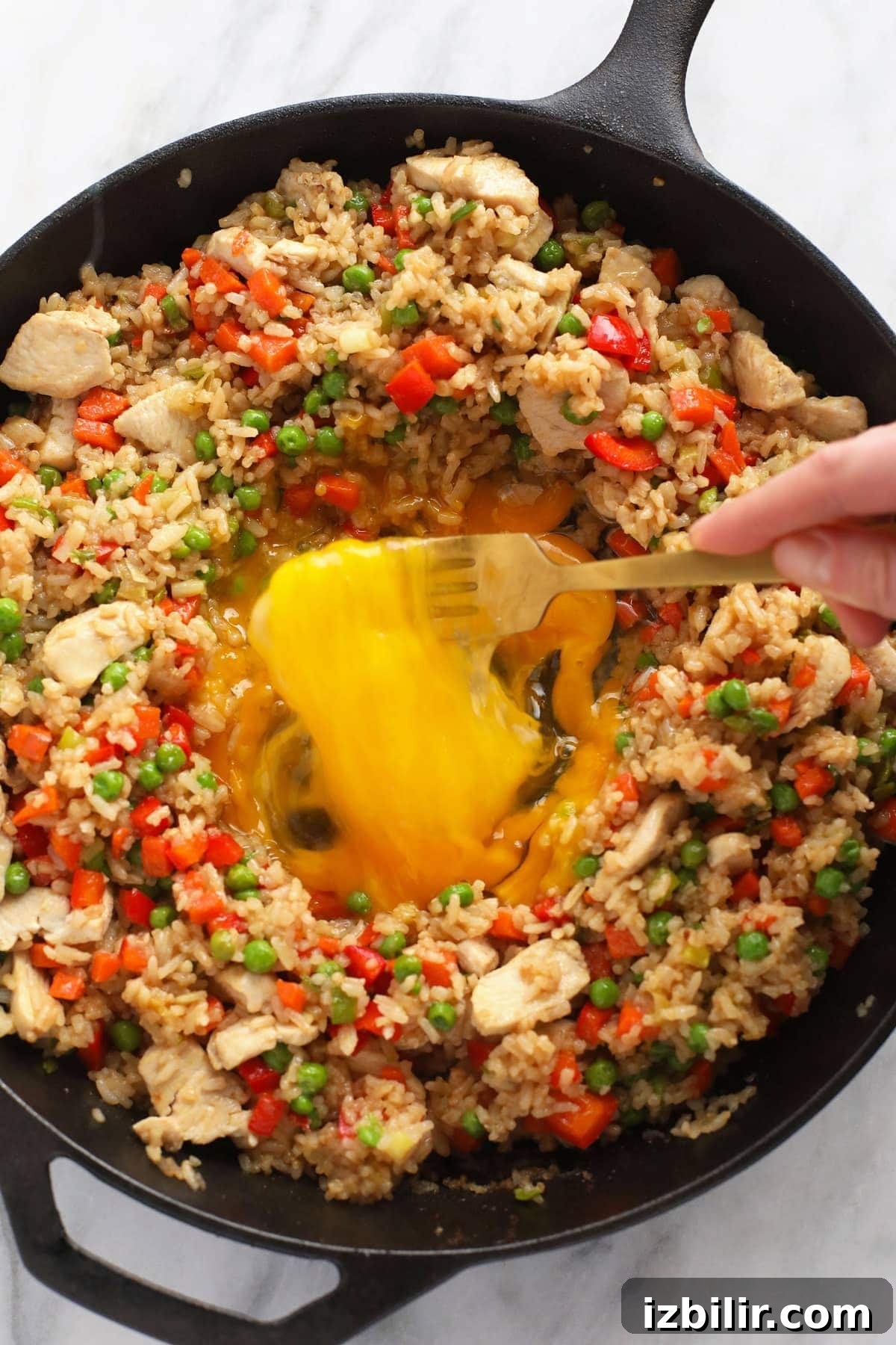 scrambling eggs in the middle of frying pan