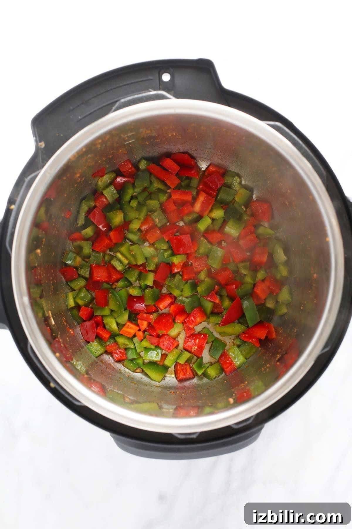 sauteed red and green peppers in the instant pot for instant pot burrito bowls
