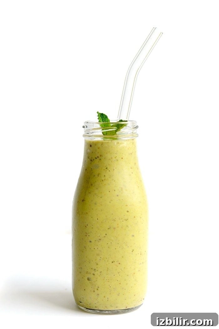 Avocado + Mint = Love! Make this delicious minty avocado banana smoothie for a refreshing, flavorful smoothie that will keep you fuller longer (thank you healthy fats!). A photo of an avocado banana smoothie
