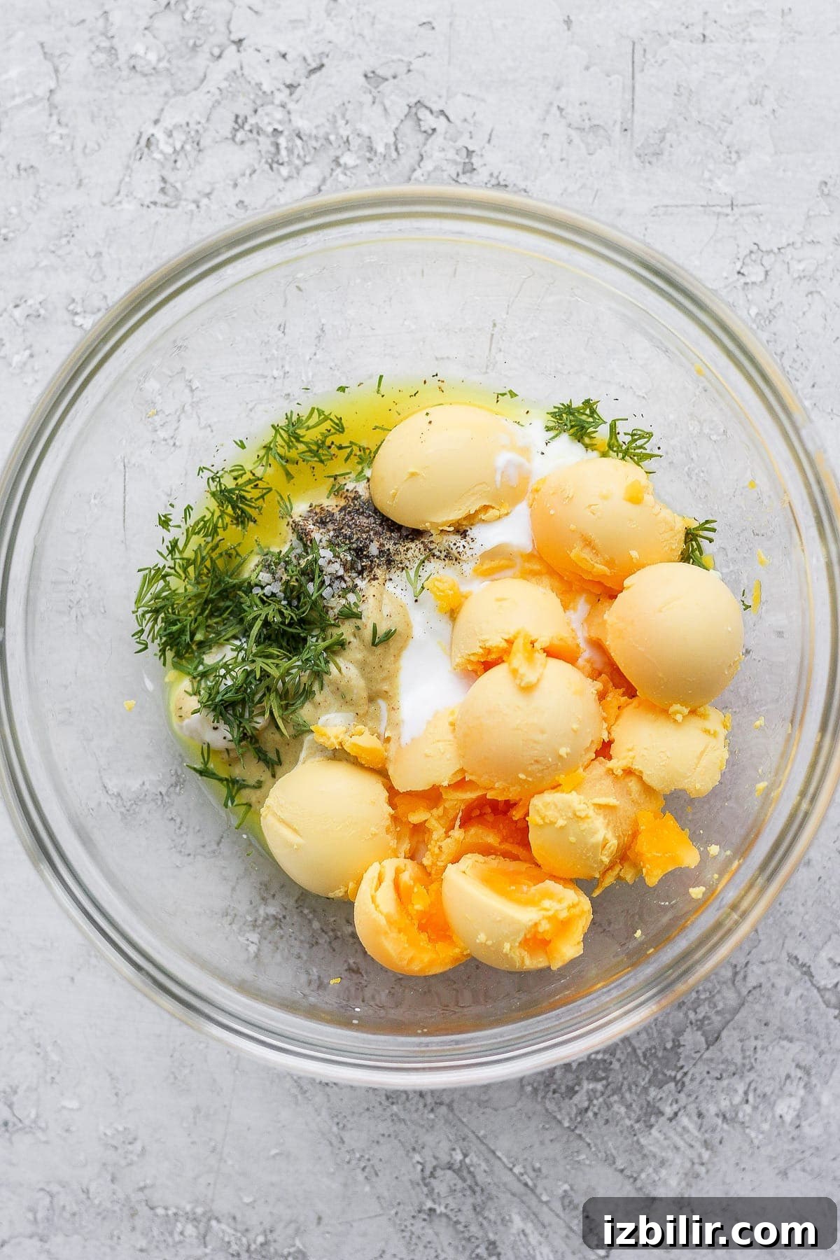 Easy deviled egg filling ingredients ready to mix easy deviled egg filling ingredients in a bowl, ready to be mixed