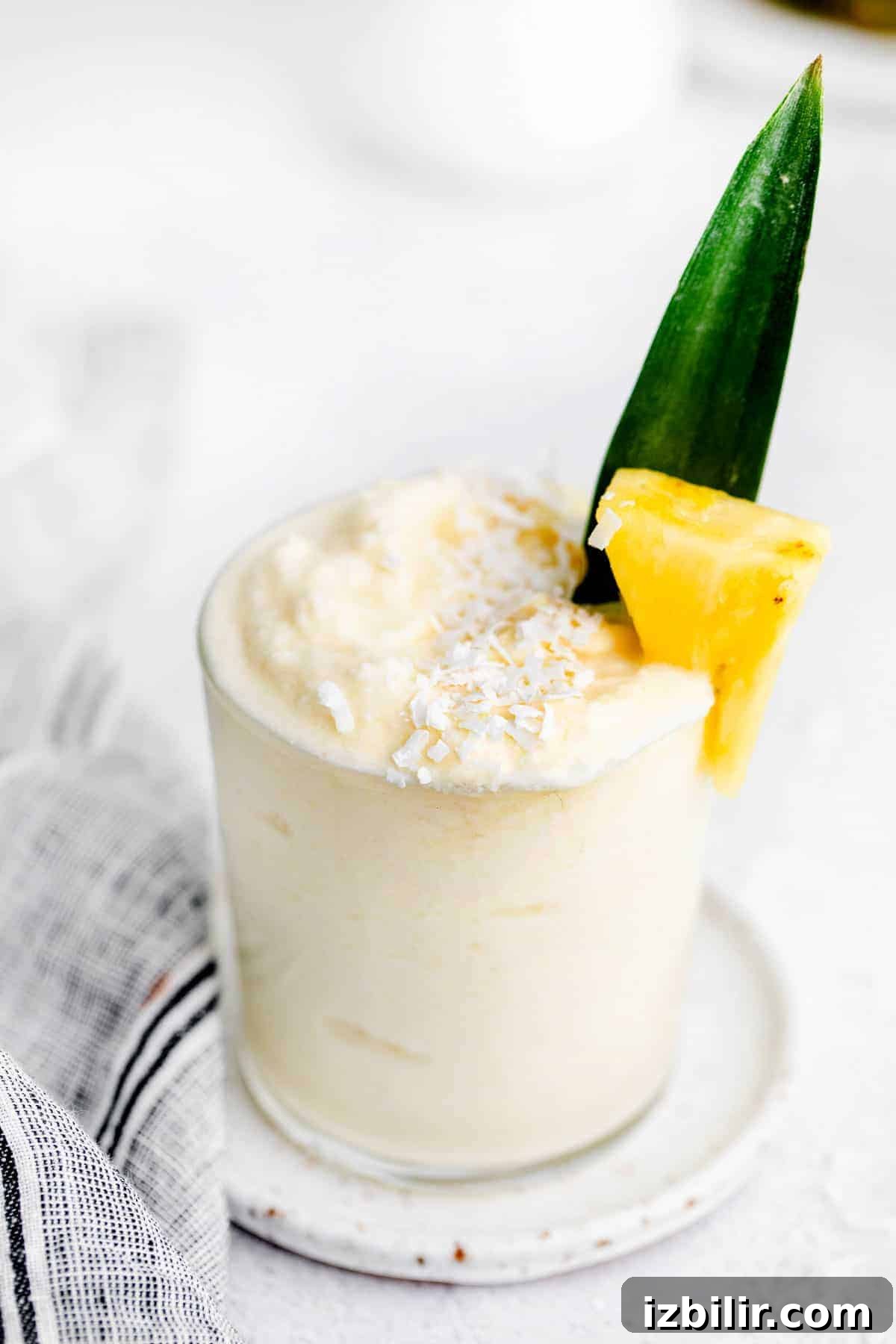 pina colada in glass with frozen pineapple