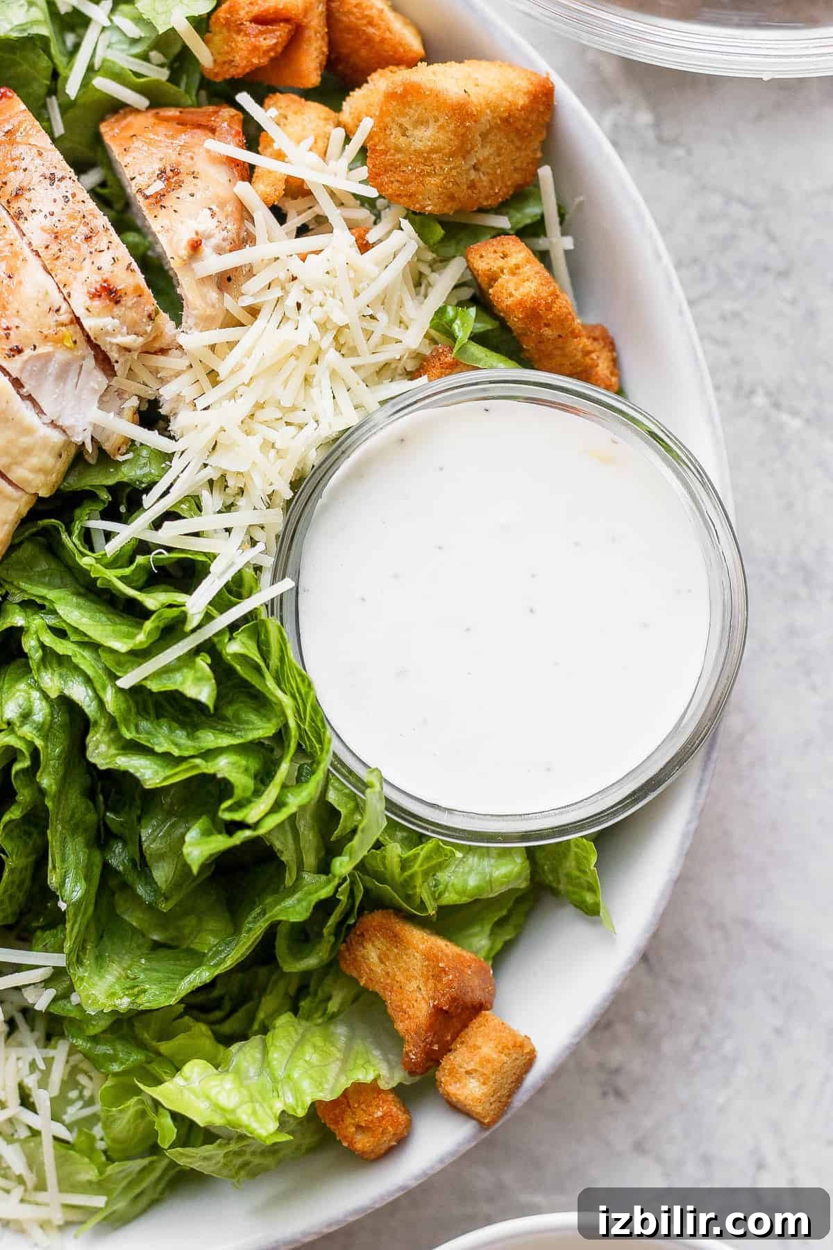 Crispy Chicken Caesar Salad with Homemade Dressing 4 Caesar dressing in a bowl.