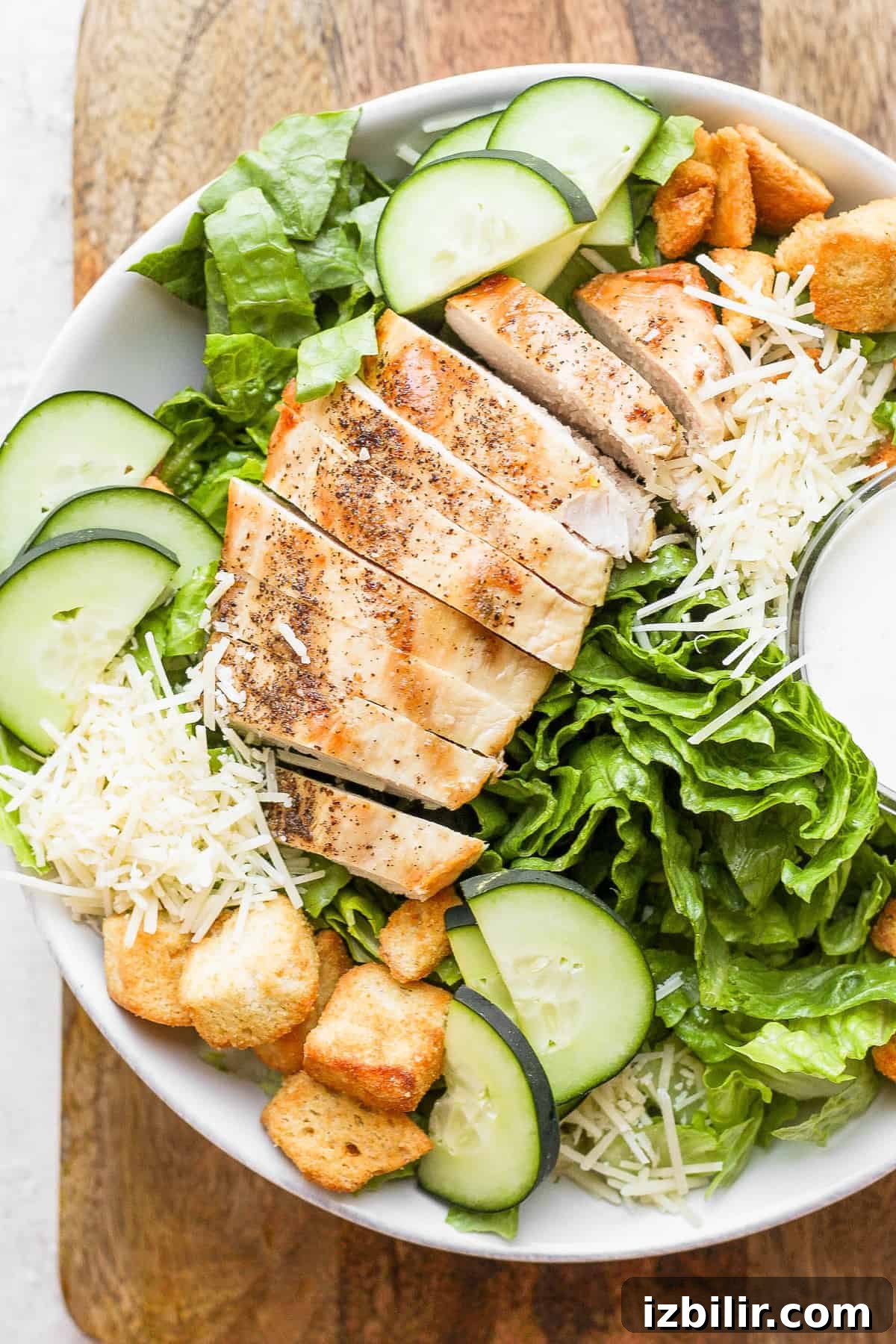 Crispy Chicken Caesar Salad with Homemade Dressing 6 Chicken caesar salad in a bowl.