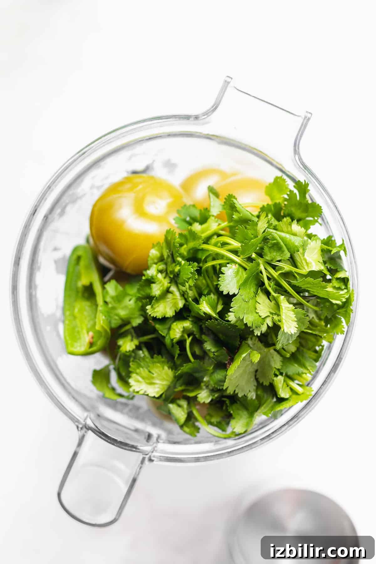 All the ingredients for this salsa verde recipe in a blender.