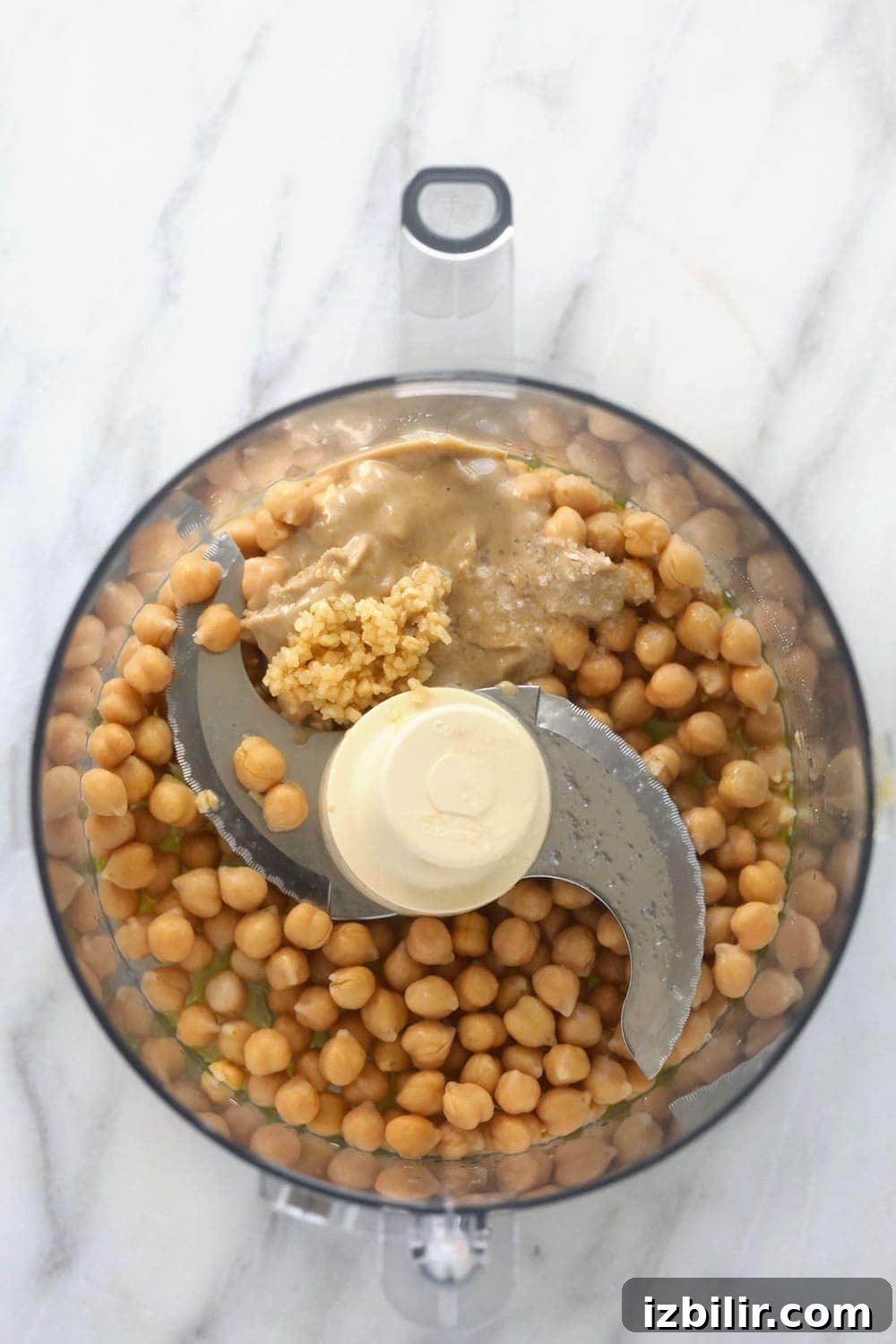 Hummus ingredients in a food processor lemon garlic hummus ingredients in a food processor