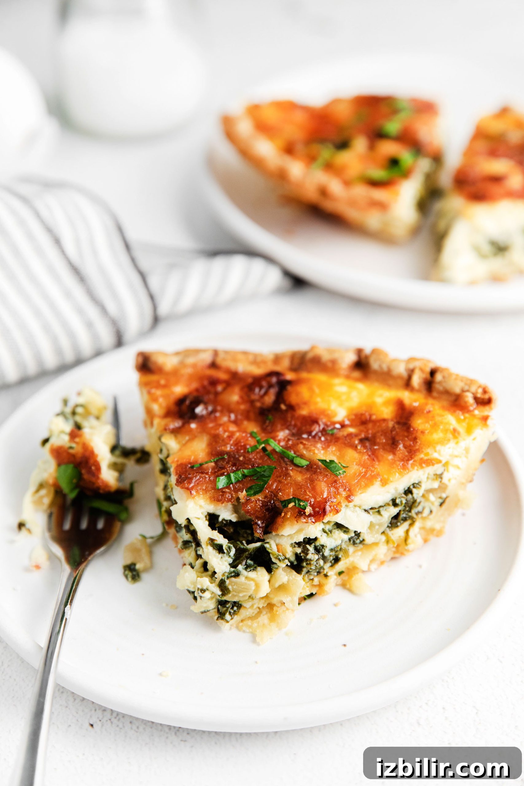 Spinach Quiche Recipe with Flaky Pastry Crust 8 Spinach quiche on a plate!