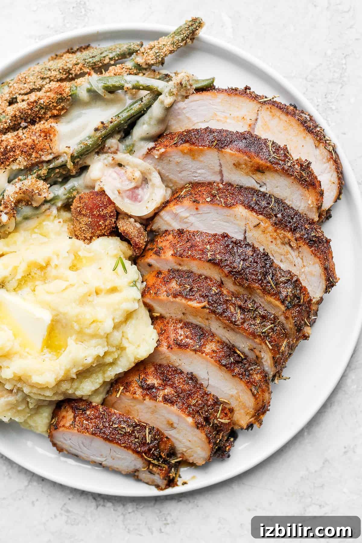 sliced turkey tenderloin on plate.