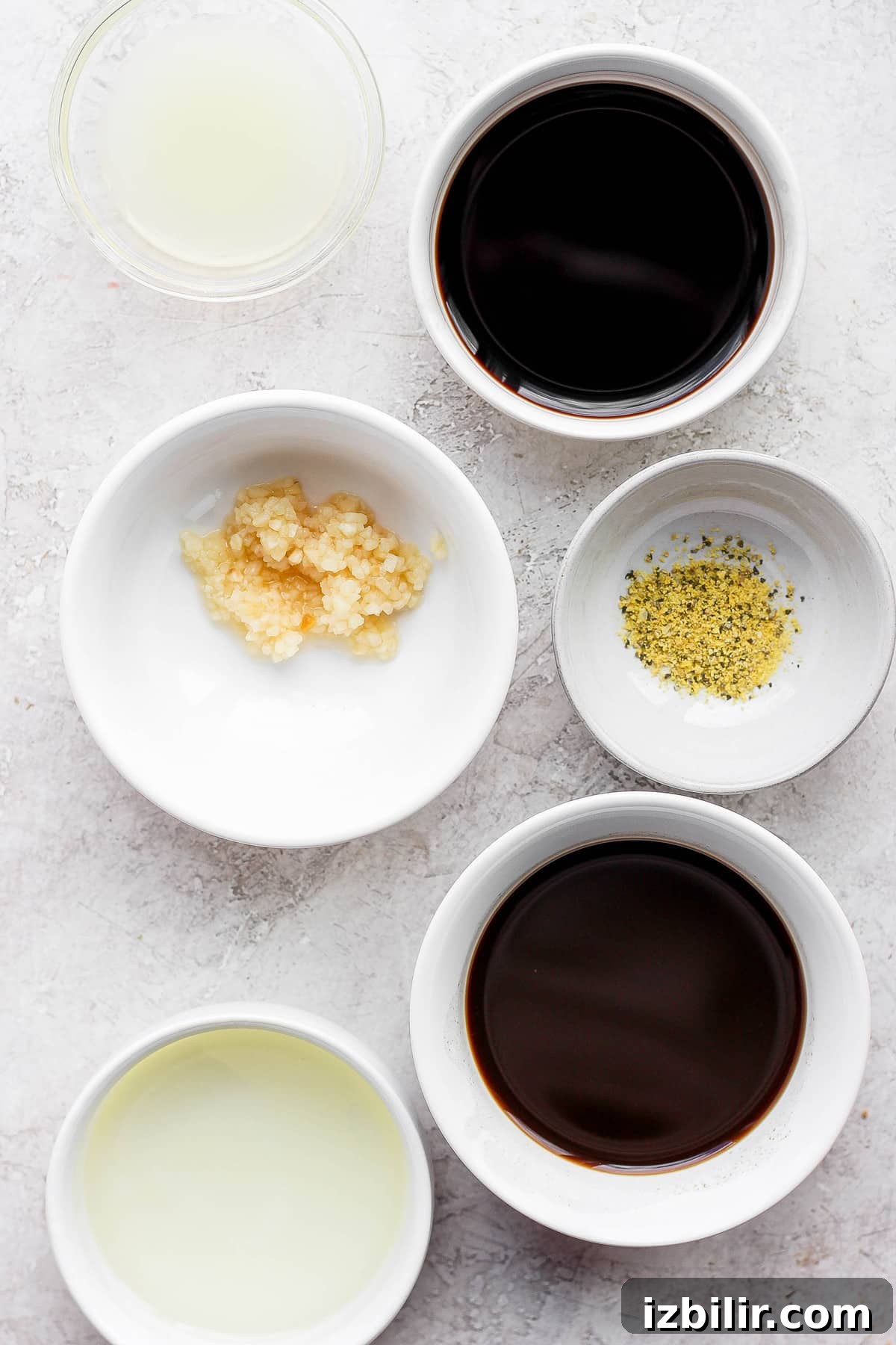 Add juicy, savory flavors to your next steak by making this easy steak marinade. This delicious steak marinade is made with Worcestershire sauce, balsamic vinegar, garlic, and a touch of lemon. marinade ingredients in bowls.