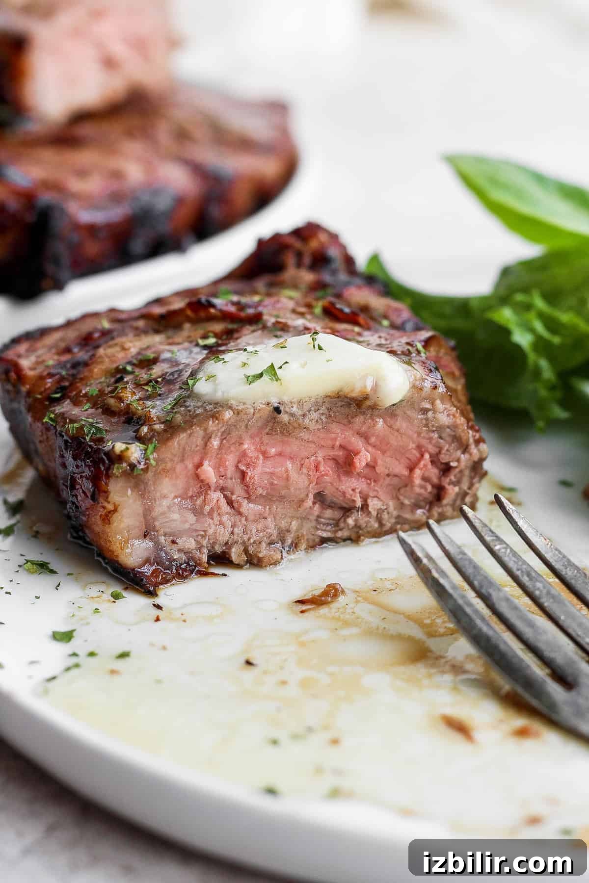 Sliced steak with butter steak sliced into with butter.