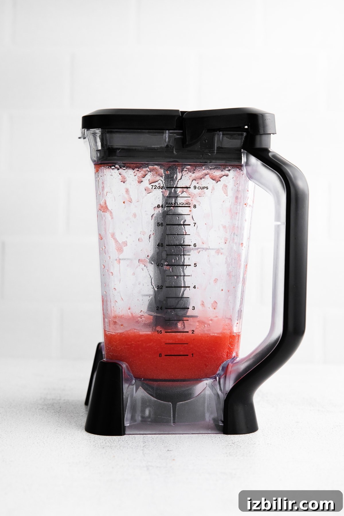 blended strawberry margarita in blender