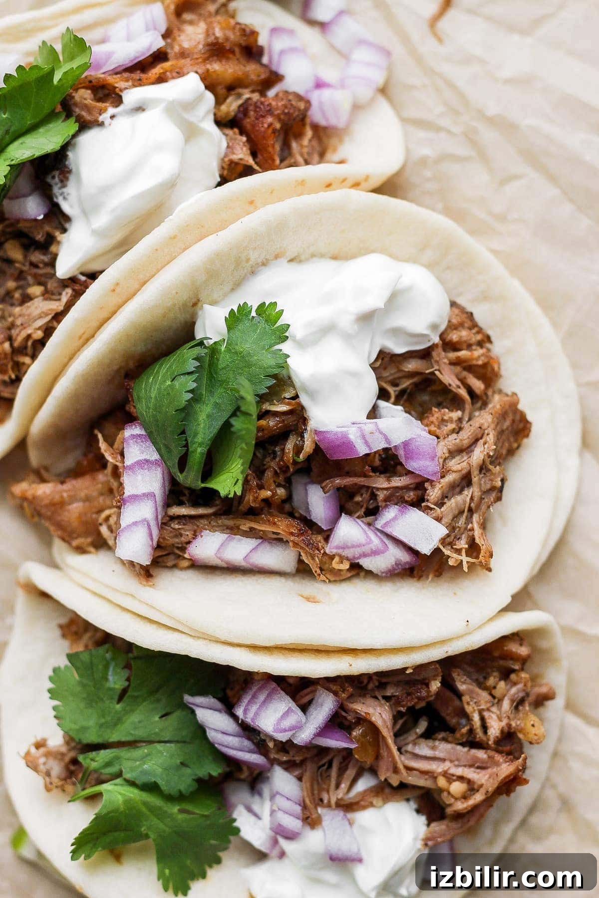 Carnitas in a taco shell. 