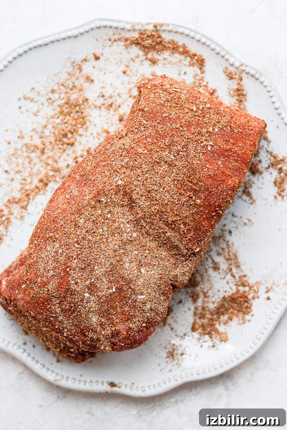 A pork roast dry rubbed in spices. 