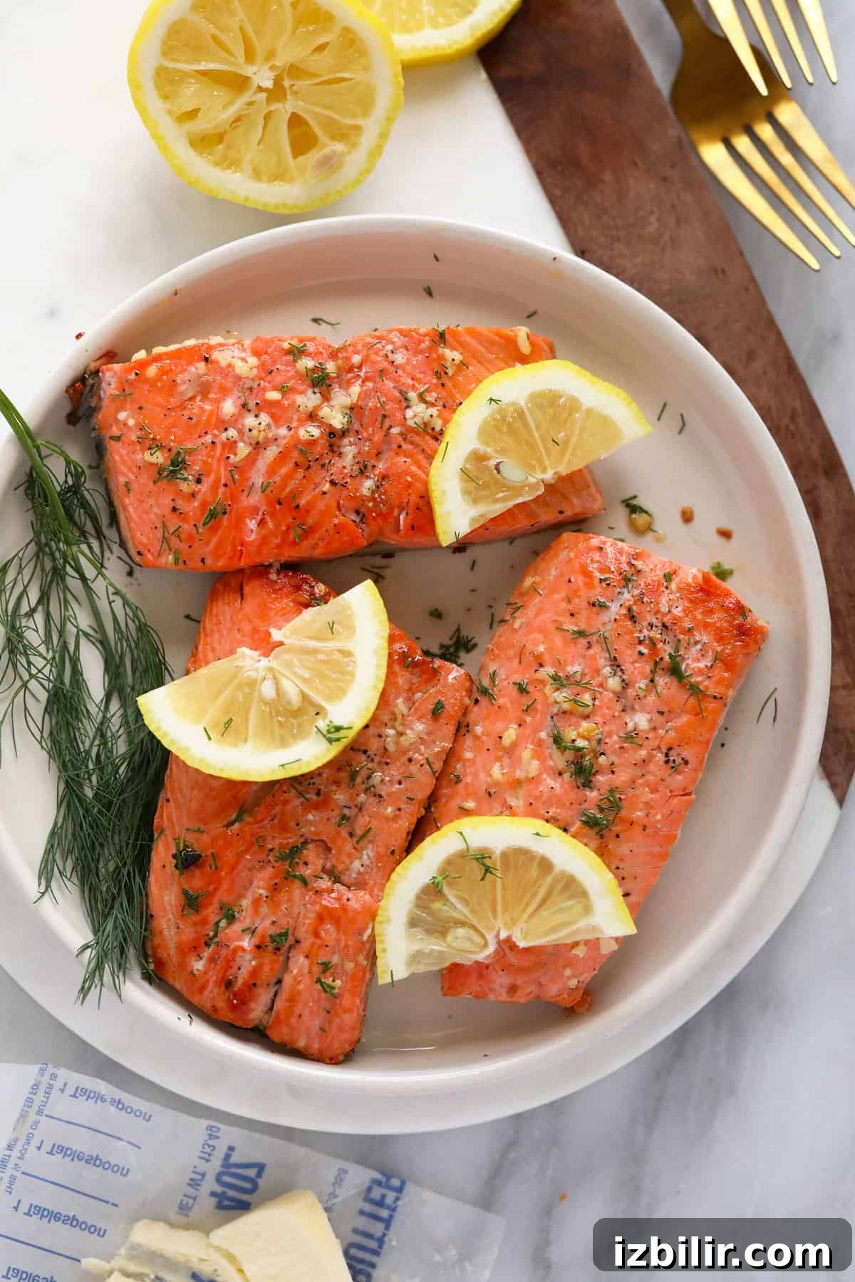 Cooked salmon fillets on plate.