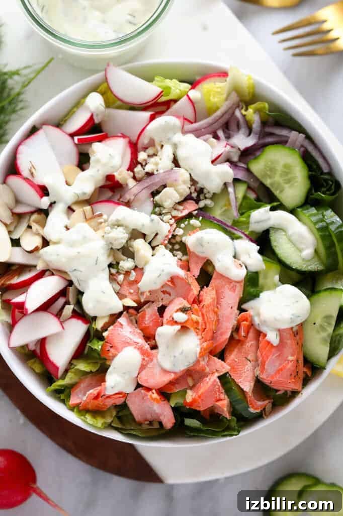 salmon salad with Greek yogurt dressing in bowl.