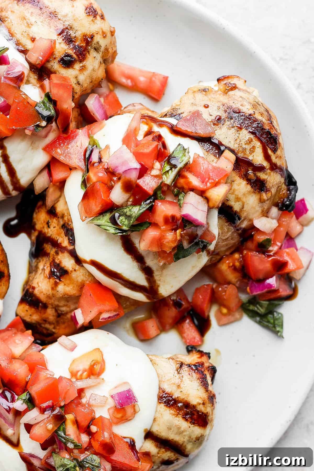 Grilled Bruschetta Chicken Recipe with Tomato Basil Topping 2 Grilled chicken breast topped with bruschetta.