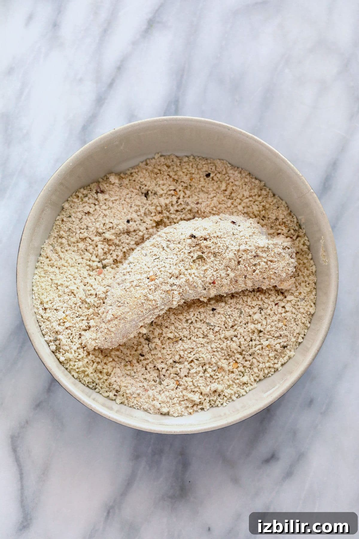 dredging chicken in breadcrumbs