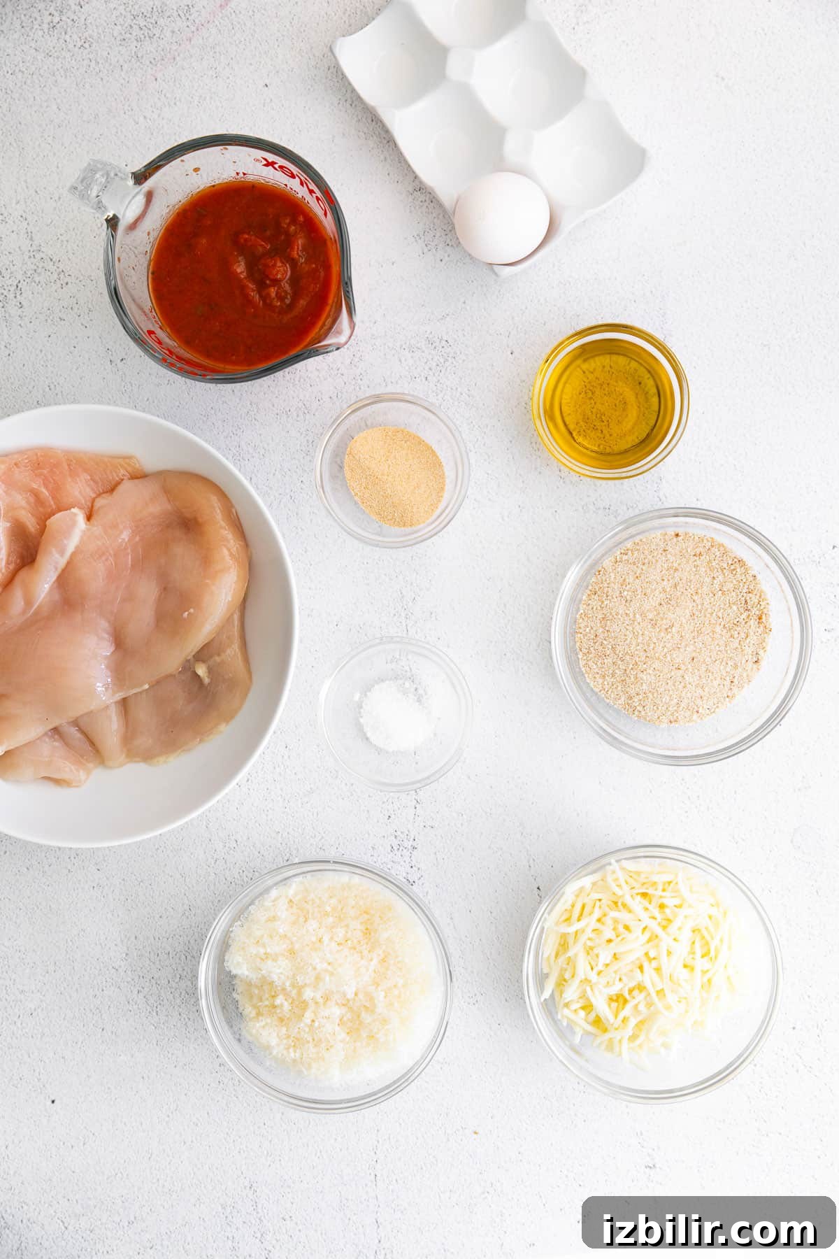 Ingredients for Chicken Parmesan Chicken parmesan ingredients on countertop.