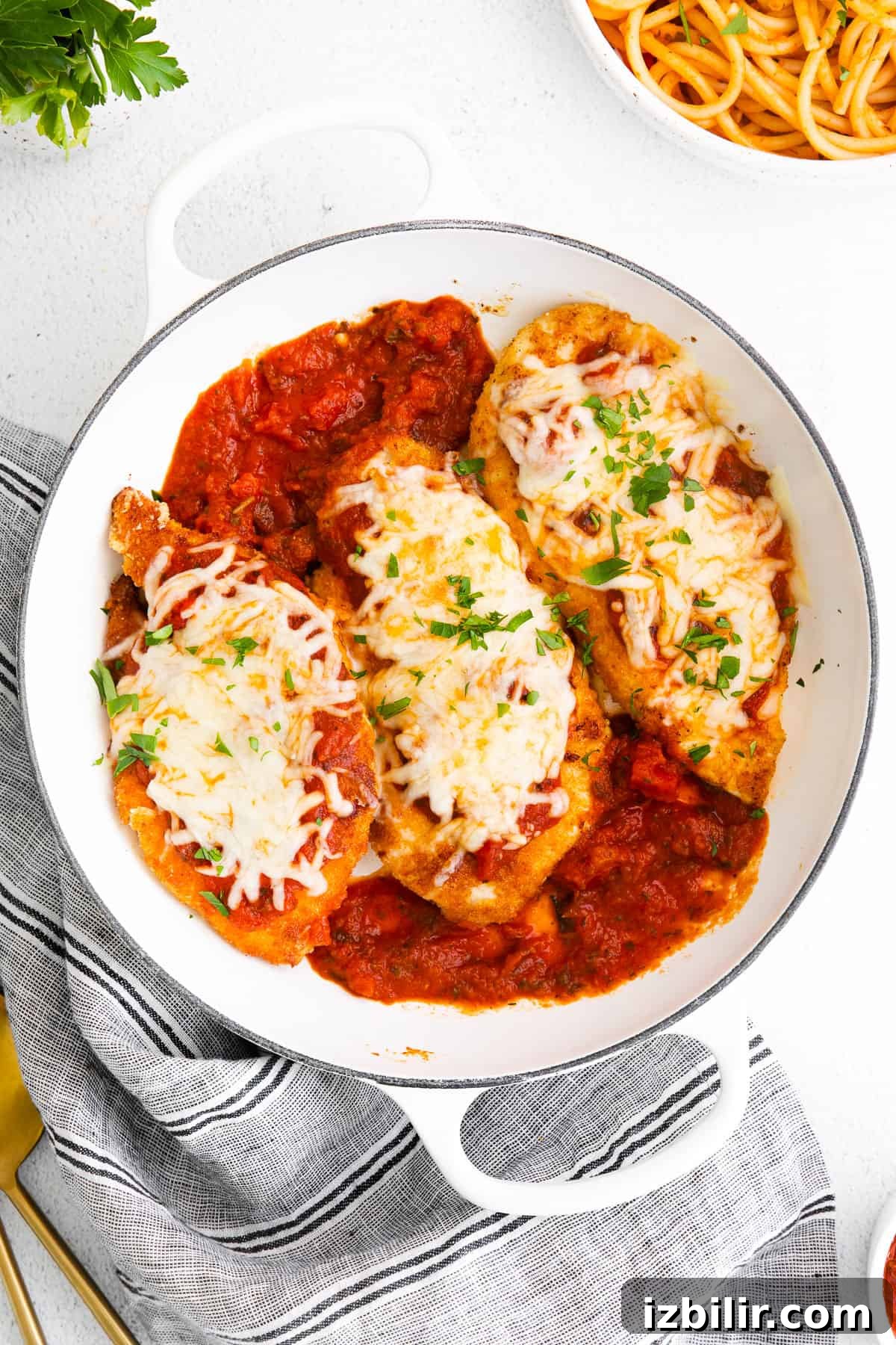 Baked Chicken Parmesan in Dish Chicken parmesan in baking dish.