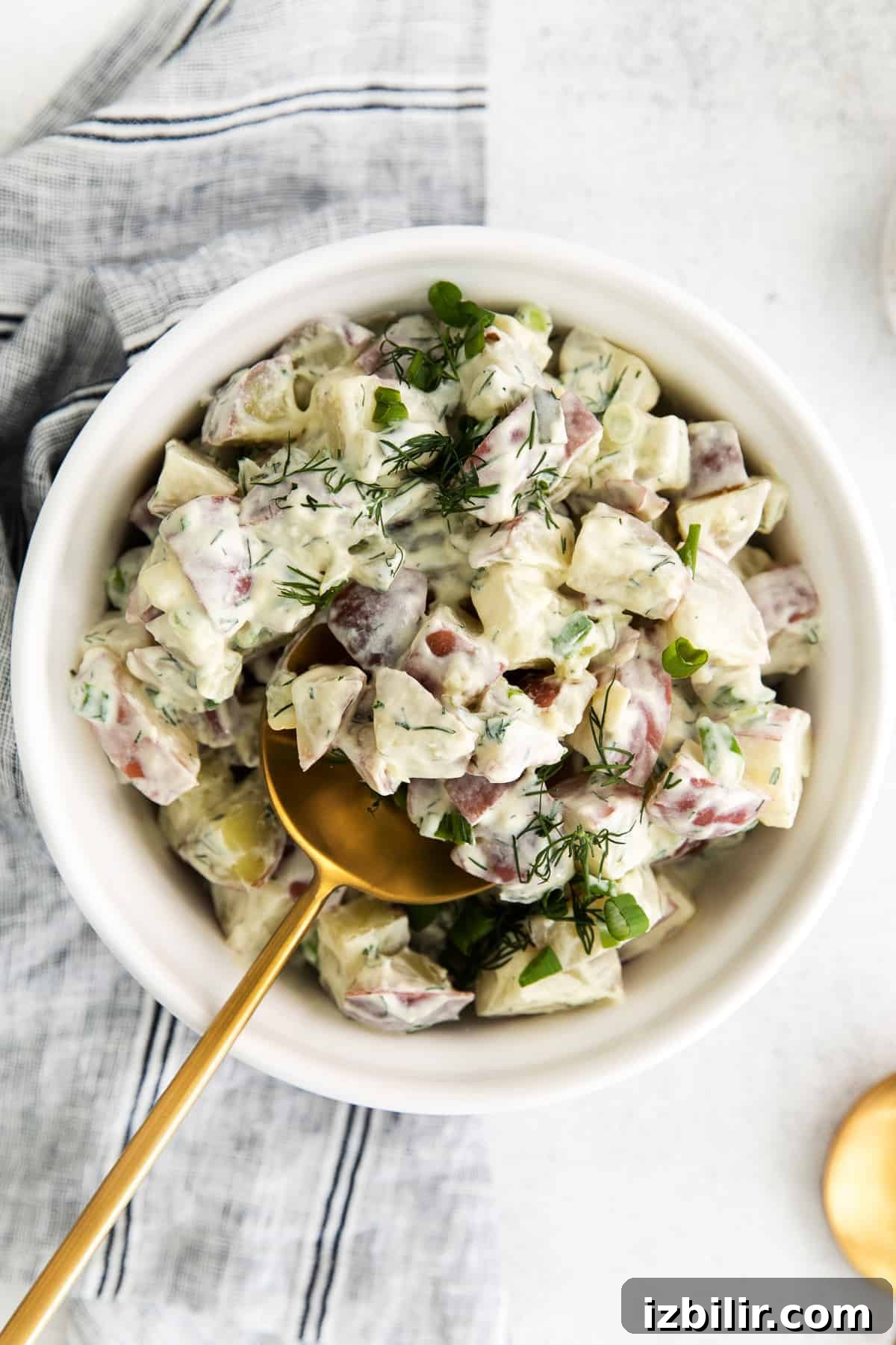 Red Potato Salad Recipe with Creamy Herb Dressing 2 A bowl of red potato salad.