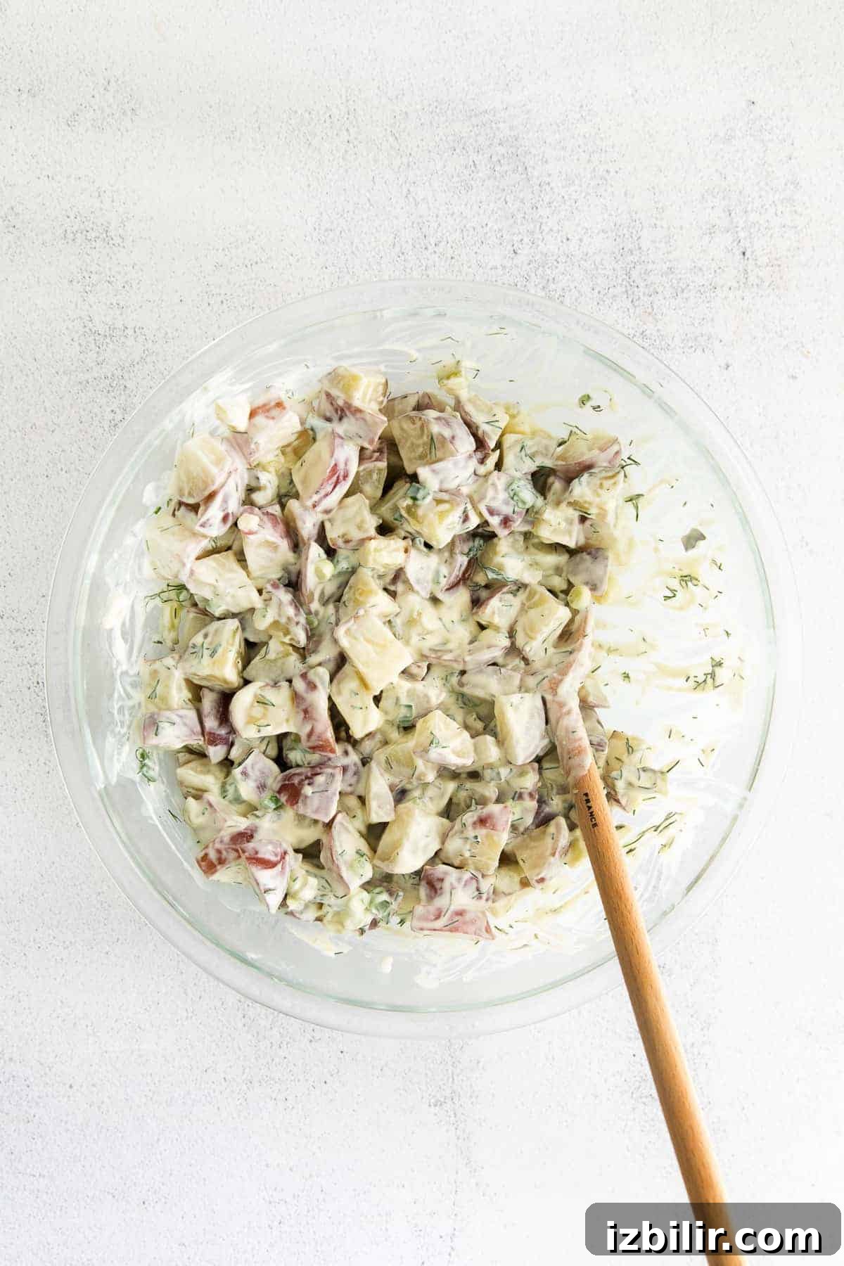 Red Potato Salad Recipe with Creamy Herb Dressing 5 Red potato salad in a bowl.