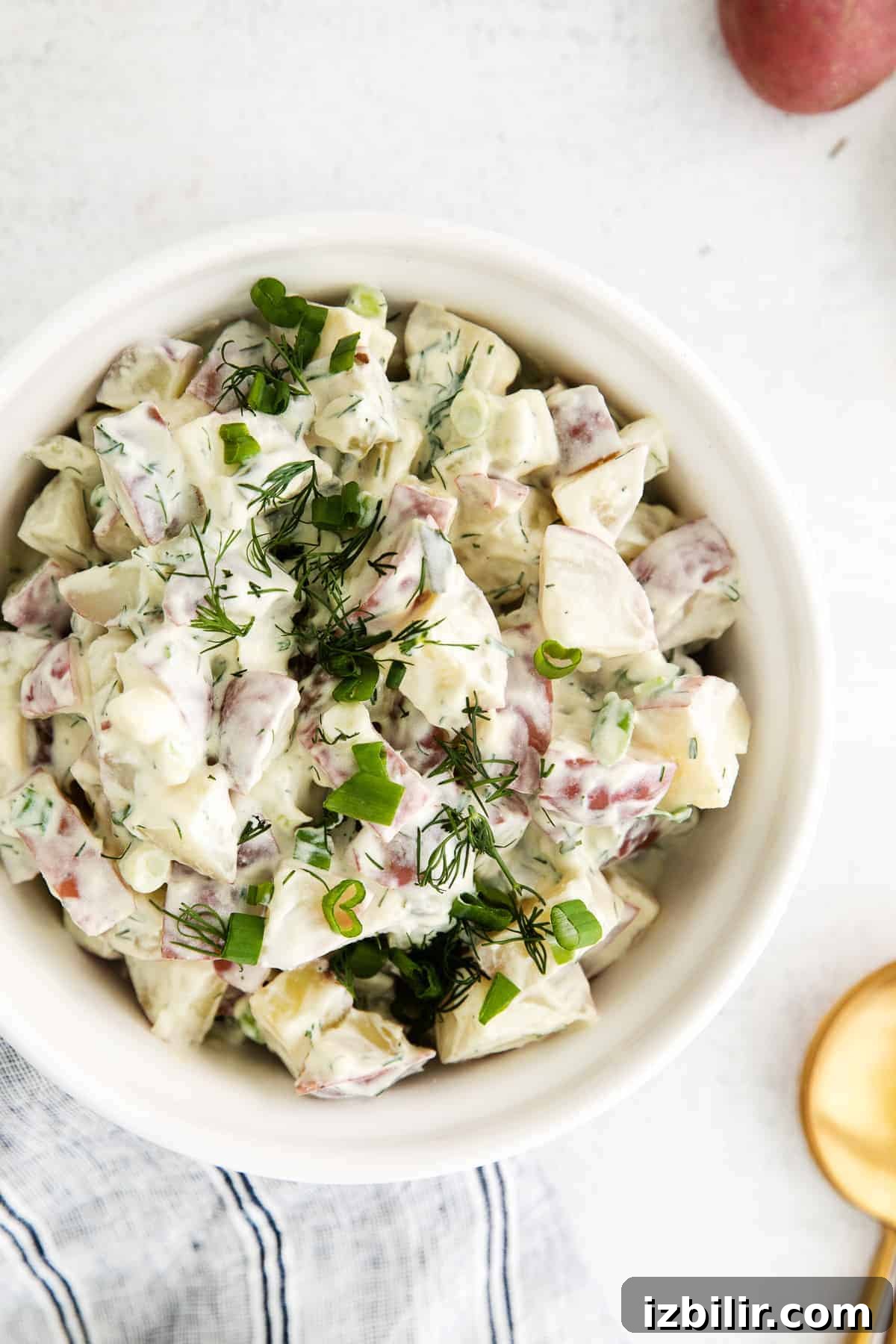 Red Potato Salad Recipe with Creamy Herb Dressing 7 A bowl of red potato salad.