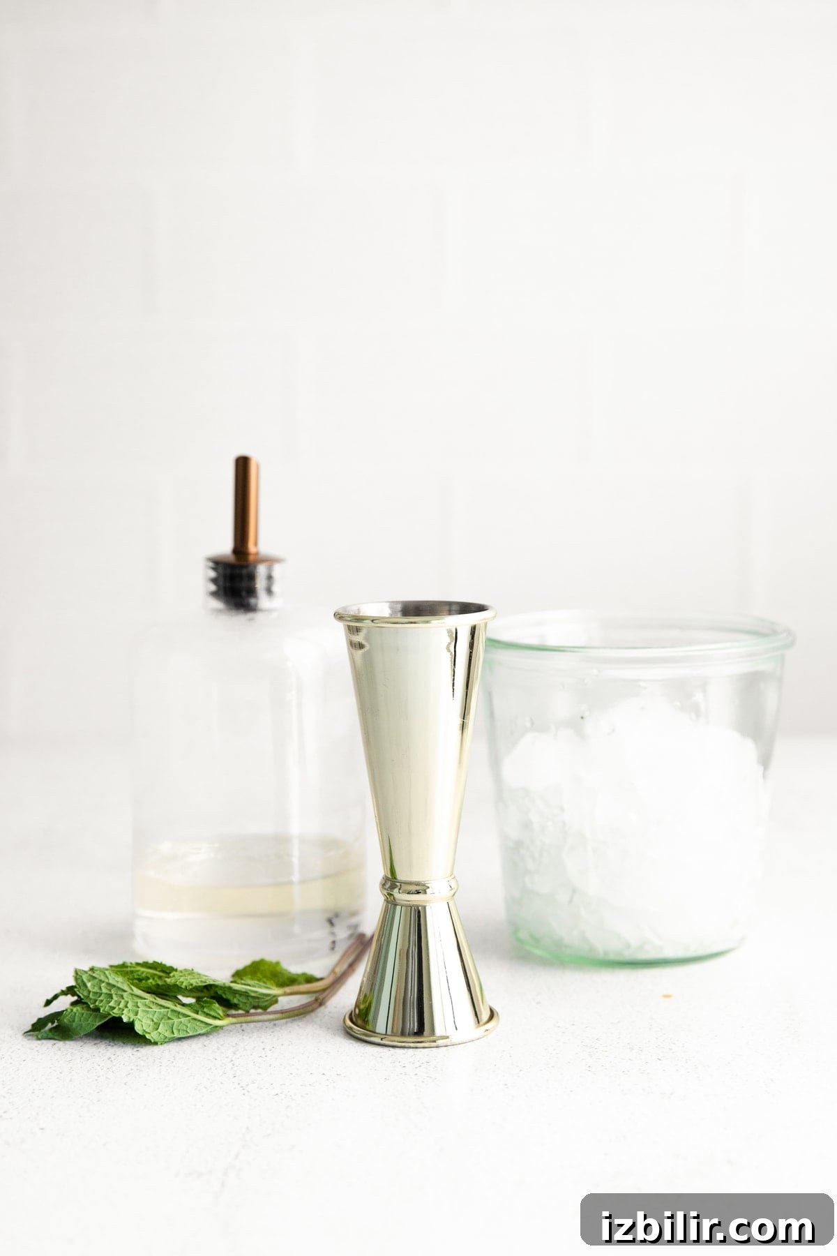 Classic Bourbon Mint Julep Cocktail Recipe 3 mint julep ingredients, ready to be mixed together.