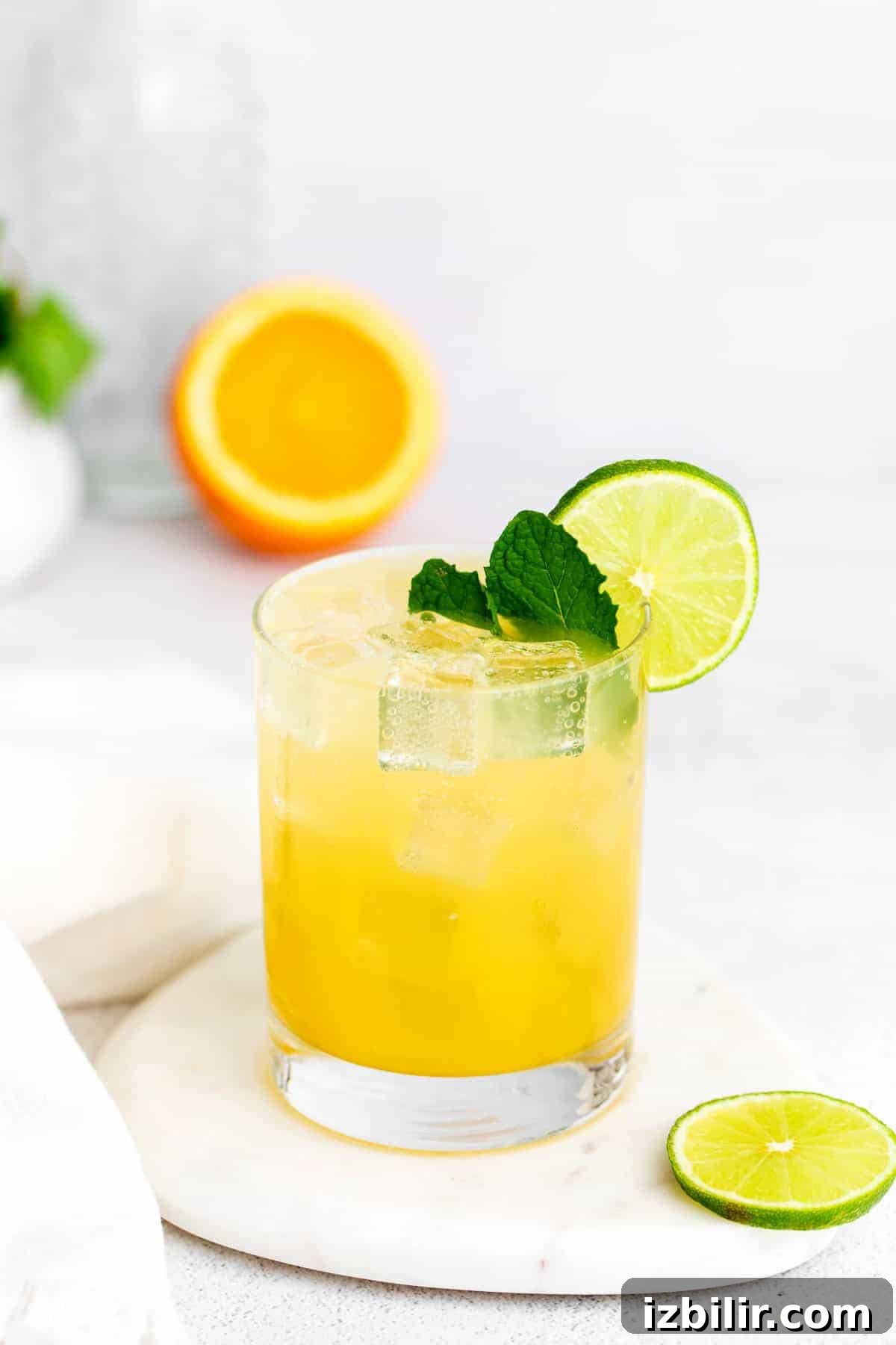 margarita with mint and a lime wedge.