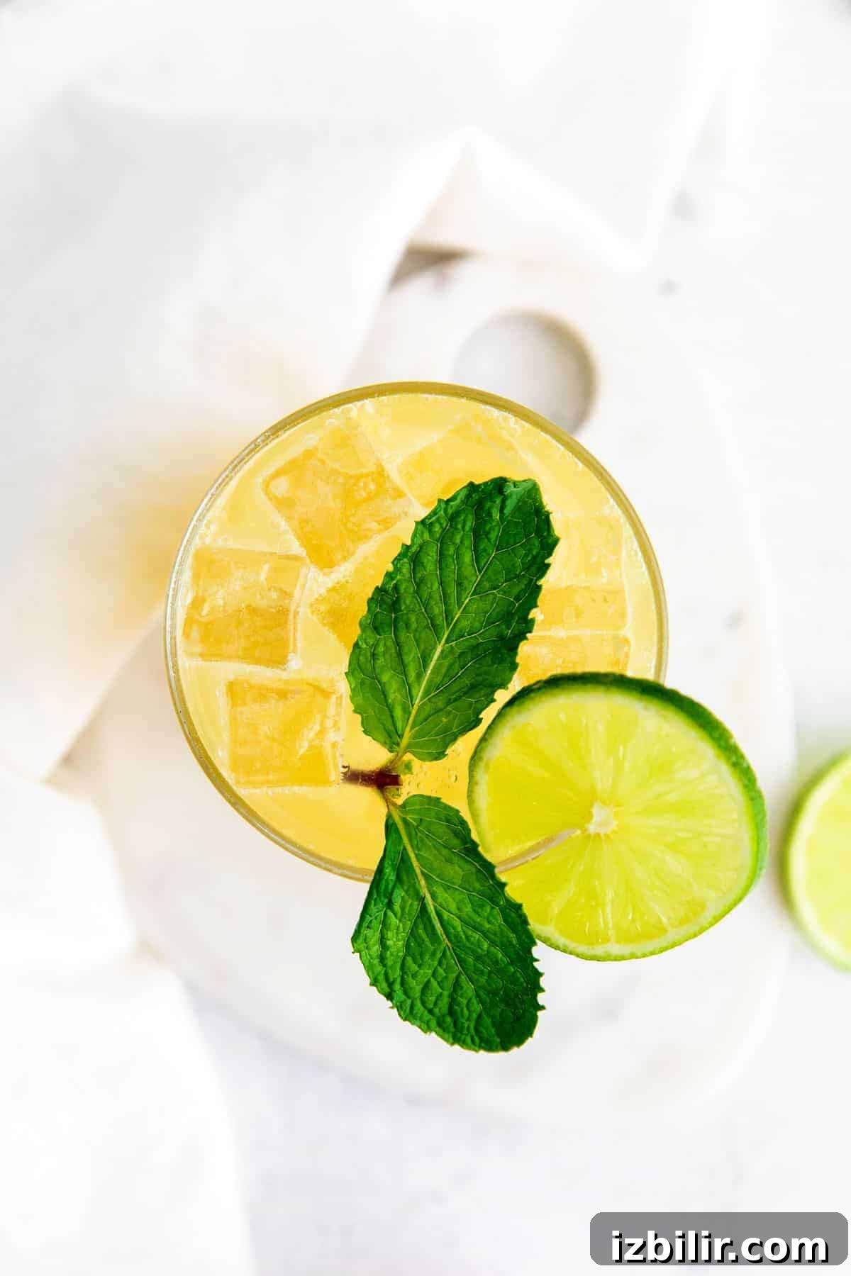 glass full of margarita and a lime wedge.