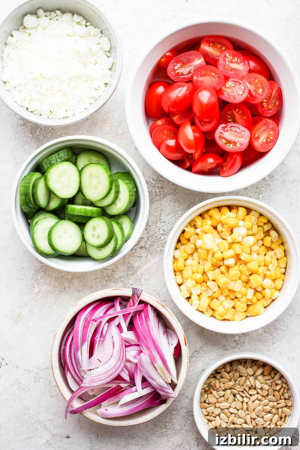 steak salad ingredients in bowls.