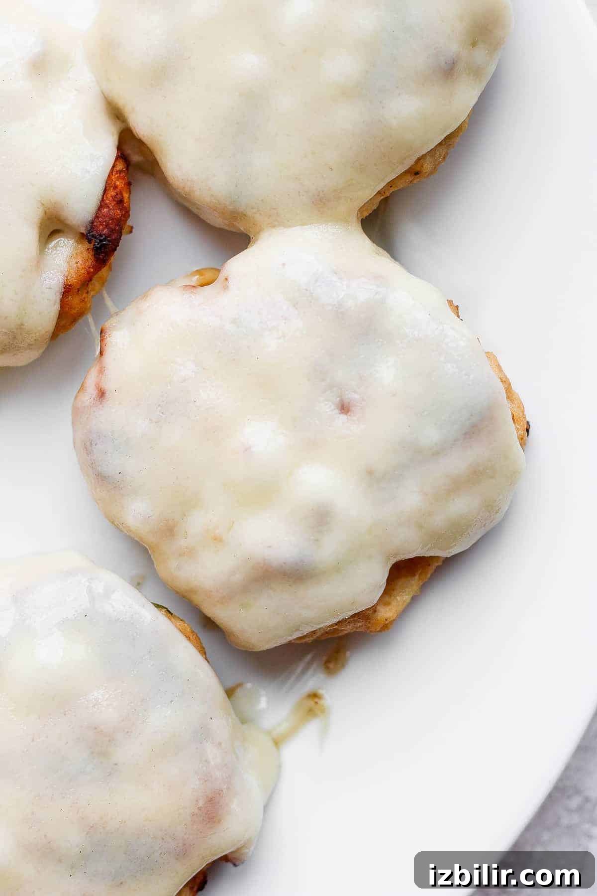 melted Swiss cheese on chicken burger.