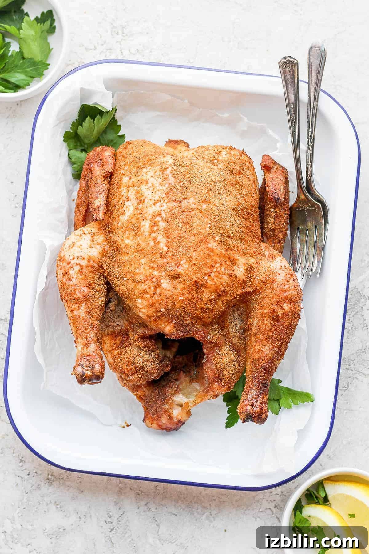 A whole smoked chicken with dry rub.