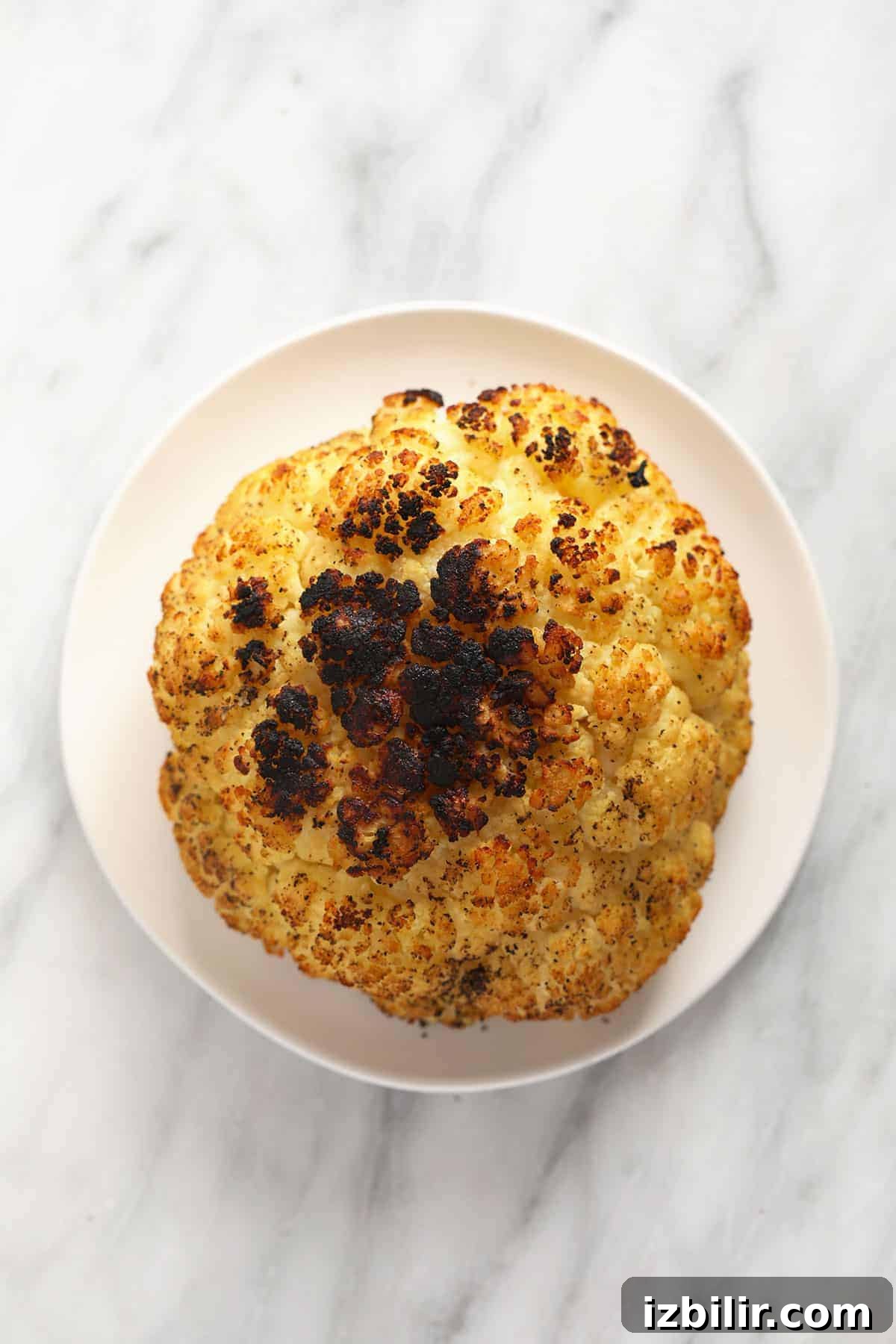 Grilled cauliflower on a plate.