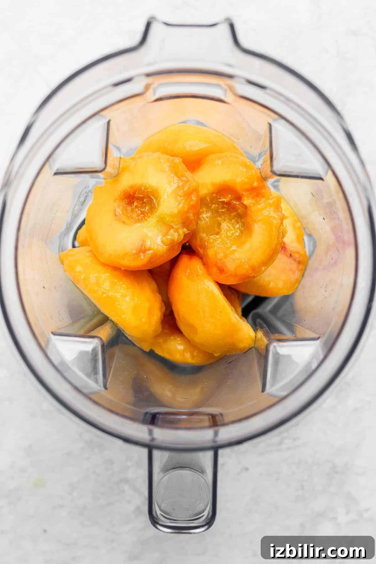 Blend peeled peaches with a little water to make smooth peach puree. fresh sliced peaches in a blender