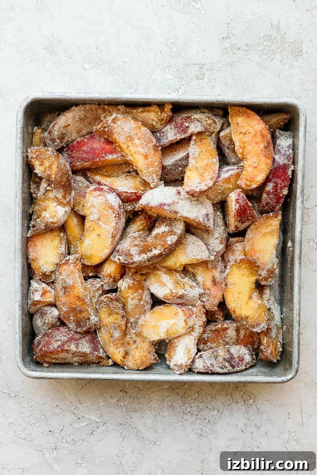 Peach crisp ingredients ready to be combined. Peach crisp ingredients in a baking dish.