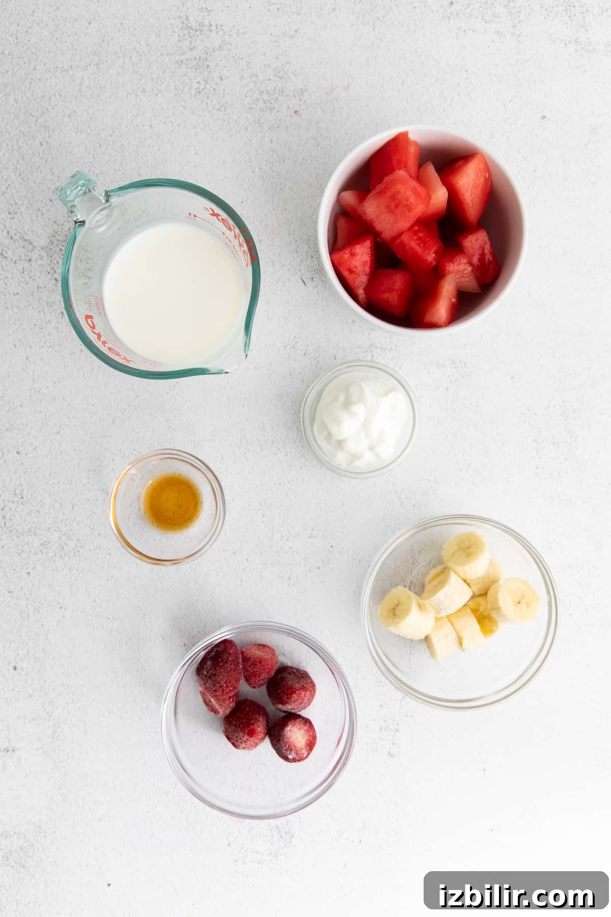 Refreshing Watermelon Smoothie Recipe 3 All the ingredients for the watermelon smoothie in small bowls.