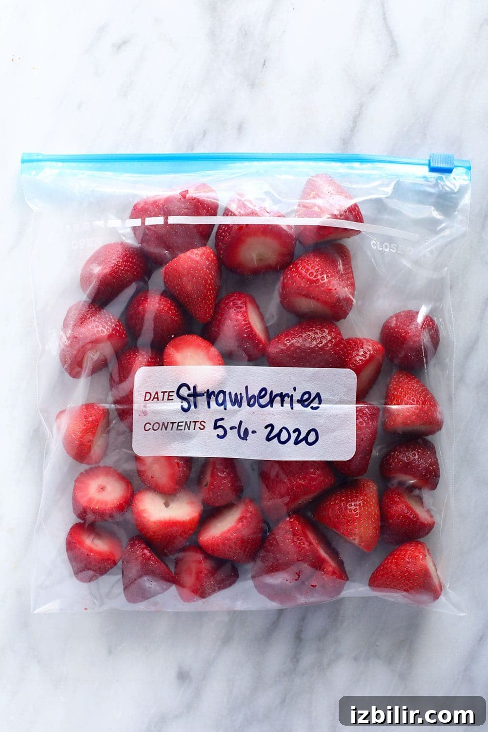 How to Freeze Strawberries Without Freezer Burn 2 Frozen strawberries in a bag.