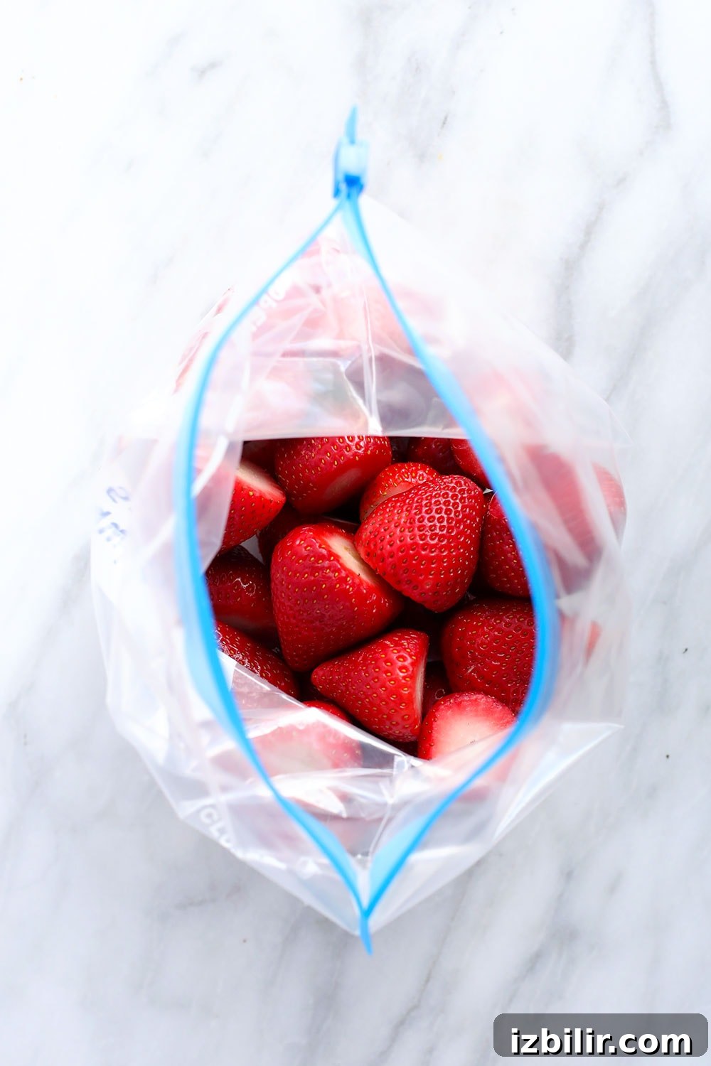 How to Freeze Strawberries Without Freezer Burn 6 A bag of frozen strawberries.