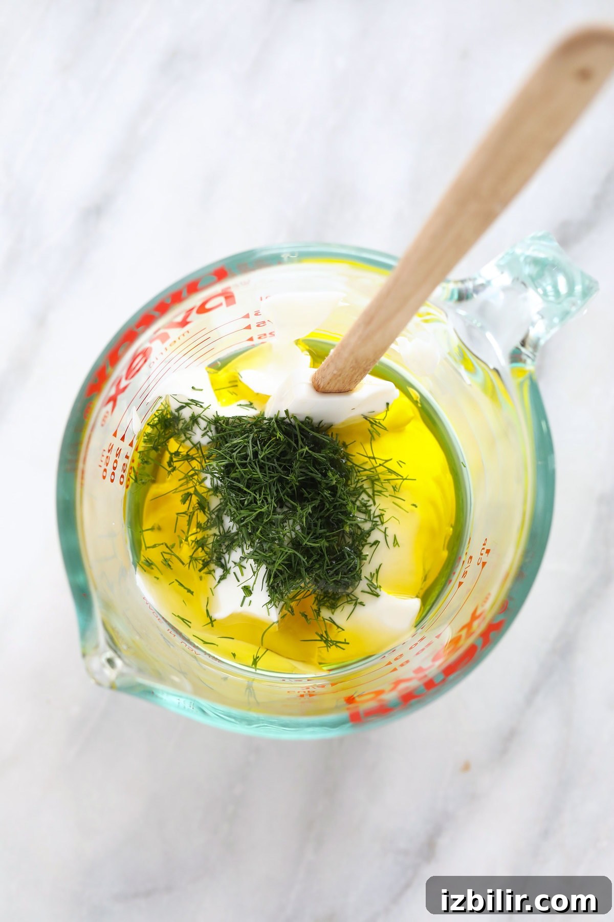 Ingredients in a bowl Greek yogurt dressing ingredients in Pyrex